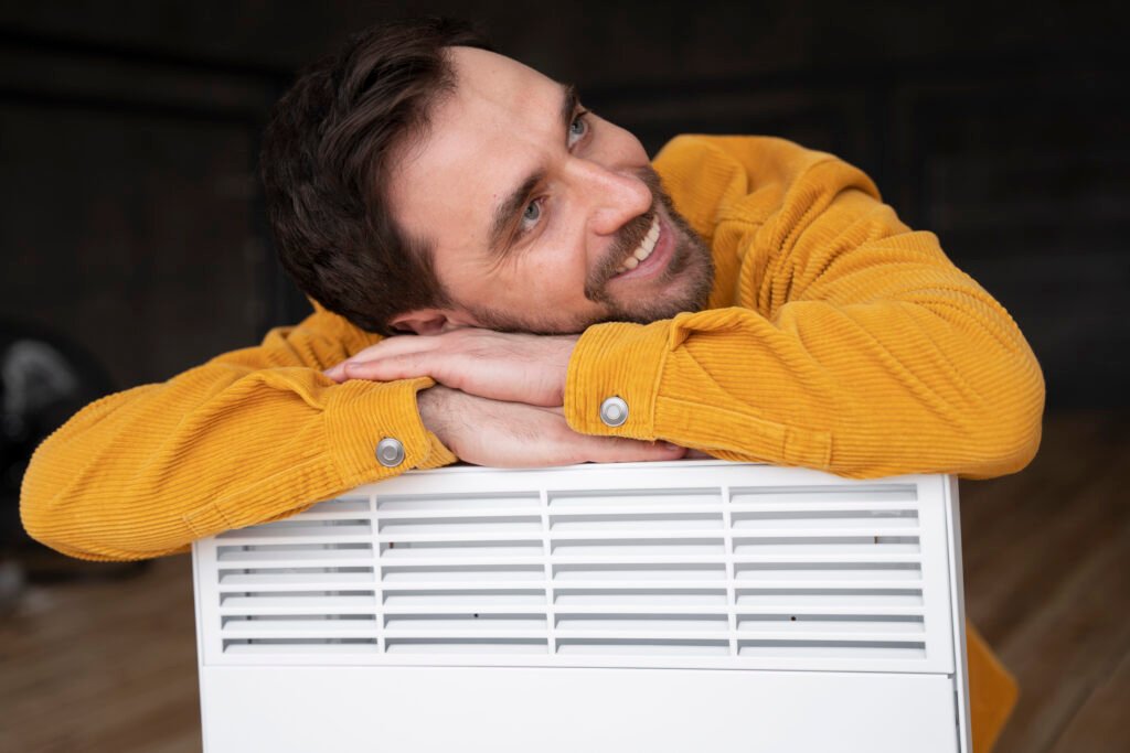 medium-shot-smiley-man-with-heater